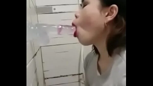 Asian deepthroating a dildo